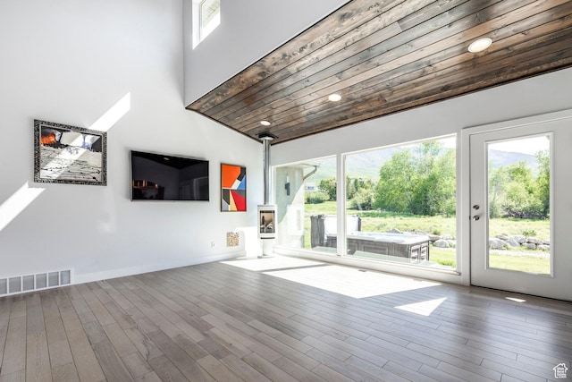 3824 N Patiosprings Dr, Eden, UT 84310 - unfurnished living room featuring healthy amount of natural light, wood ceiling, wood finished floors, and a high ceiling