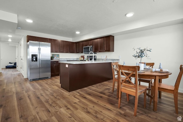 450 W Main St Unit 16, Santaquin, UT 84655 - kitchen with appliances with stainless steel finishes, dark brown cabinets, dark wood-style flooring, a peninsula, and recessed lighting