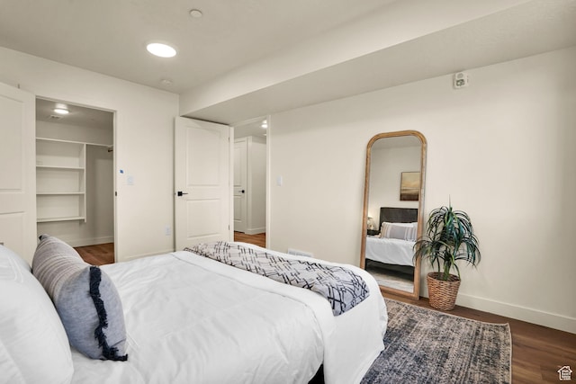 450 W Main St Unit 16, Santaquin, UT 84655 - bedroom featuring baseboards, wood finished floors, a spacious closet, and a closet