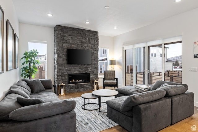 6592 Purple Poppy Ln Unit 117, Park City, UT 84098 - living room featuring light wood-style flooring, a fireplace, baseboards, and recessed lighting