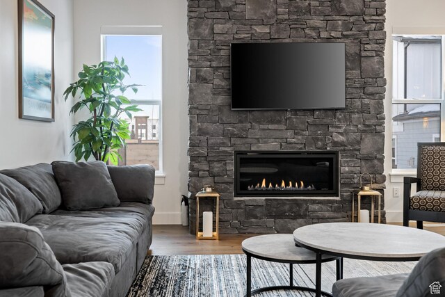 6592 Purple Poppy Ln Unit 117, Park City, UT 84098 - living room featuring wood finished floors and a stone fireplace