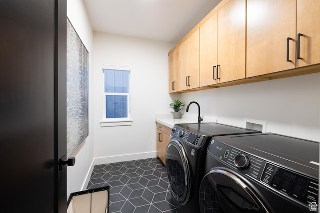 6592 Purple Poppy Ln Unit 117, Park City, UT 84098 - washroom featuring washing machine and dryer, cabinet space, baseboards, and dark tile patterned flooring