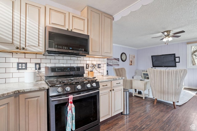 1632 W Whitlock Ave, West Valley City, UT 84119 - kitchen with appliances with stainless steel finishes, backsplash, dark wood-style flooring, ceiling fan, and crown molding