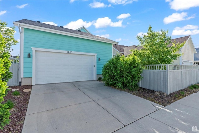 10451 S Abbott Way S, Jordan, UT 84009 - view of home's exterior featuring concrete driveway and an attached garage