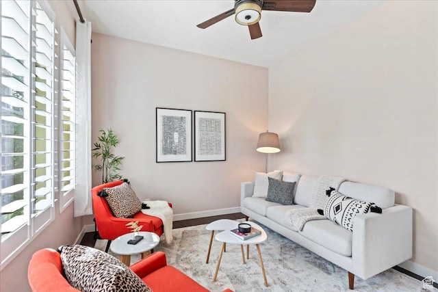 10451 S Abbott Way S, Jordan, UT 84009 - living room featuring plenty of natural light, ceiling fan, and baseboards