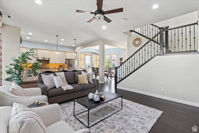 10451 S Abbott Way S, Jordan, UT 84009 - living room with baseboards, recessed lighting, ceiling fan, wood finished floors, and stairs