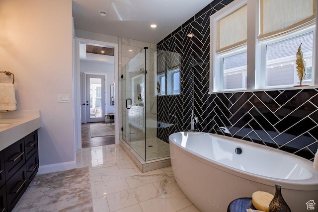 0, St. George, UT 84790 - full bath featuring vanity, a stall shower, marble finish flooring, a soaking tub, and baseboards