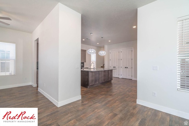 0, St. George, UT 84790 - kitchen featuring dark wood-style flooring, ceiling fan, baseboards, and recessed lighting