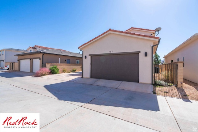 0, St. George, UT 84790 - mediterranean / spanish-style house with stucco siding, a tile roof, and driveway
