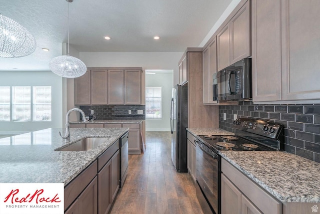 0, St. George, UT 84790 - kitchen with black appliances, a sink, backsplash, hardwood / wood-style flooring, and recessed lighting