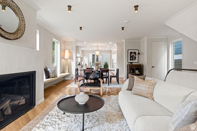 520 N H St E, Salt Lake City, UT 84103 - living room featuring plenty of natural light, ornamental molding, recessed lighting, light wood finished floors, and a glass covered fireplace