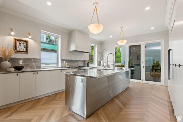 520 N H St E, Salt Lake City, UT 84103 - kitchen with a sink, custom range hood, white cabinetry, plenty of natural light, and ornamental molding