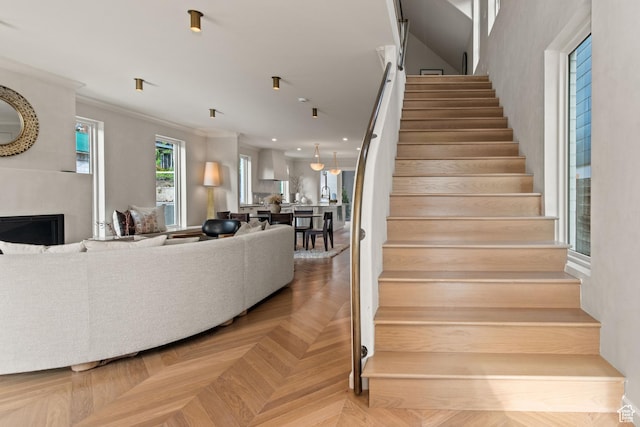 520 N H St E, Salt Lake City, UT 84103 - staircase with a large fireplace and crown molding