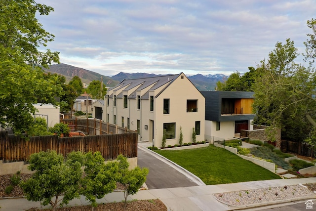 520 N H St E, Salt Lake City, UT 84103 - view of front of home featuring stucco siding and a mountain view