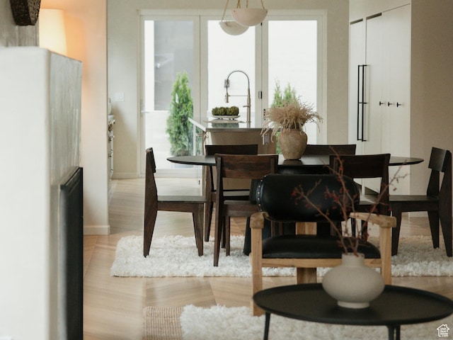 520 N H St E, Salt Lake City, UT 84103 - dining area featuring light wood-type flooring and baseboards