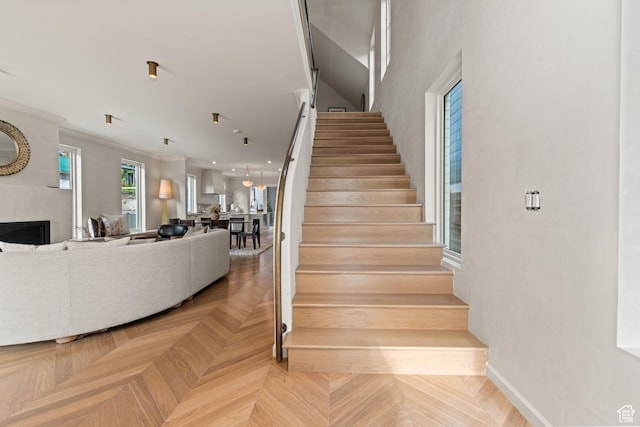 520 N H St E, Salt Lake City, UT 84103 - stairway featuring baseboards and a fireplace