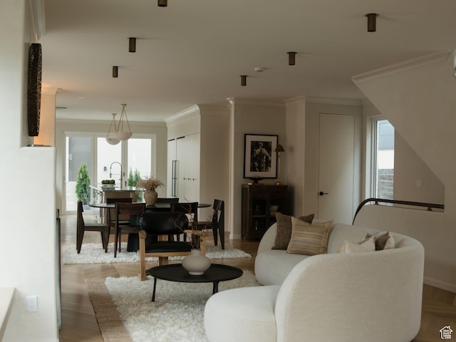 520 N H St E, Salt Lake City, UT 84103 - living room with baseboards, ornamental molding, and light wood finished floors