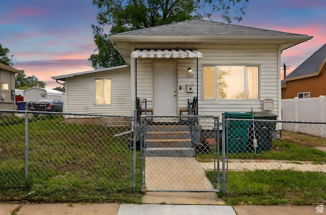 309 34th St, Ogden, UT 84401 - view of front facade with a gate and a shingled roof