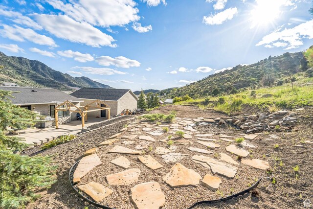 20 W Arlington Ave E, Eureka, UT 84628 - view of yard with a mountain view and a patio