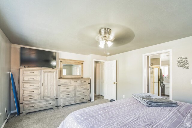 20 W Arlington Ave E, Eureka, UT 84628 - bedroom with light carpet, a ceiling fan, ensuite bath, and freestanding refrigerator