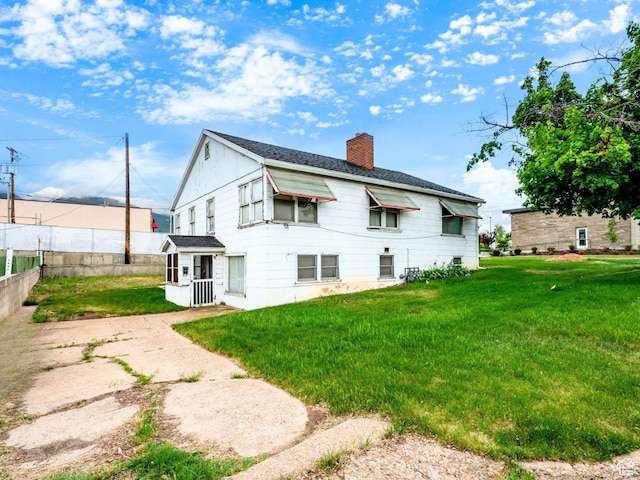 356 39th St, South Ogden, UT 84405 - back of property featuring a chimney and roof with shingles