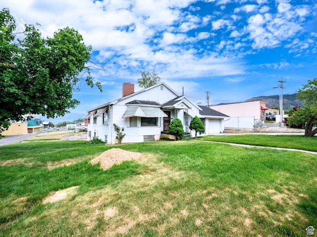356 39th St, South Ogden, UT 84405 - bungalow-style house featuring a chimney and a front yard