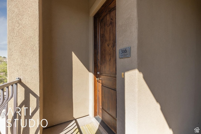 280 S Luce Del Sol Dr Unit 316, St George, UT 84770 - property entrance with stucco siding and a balcony