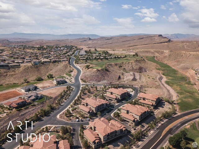 280 S Luce Del Sol Dr Unit 316, St George, UT 84770 - aerial view of property and surrounding area featuring a mountainous background and nearby suburban area