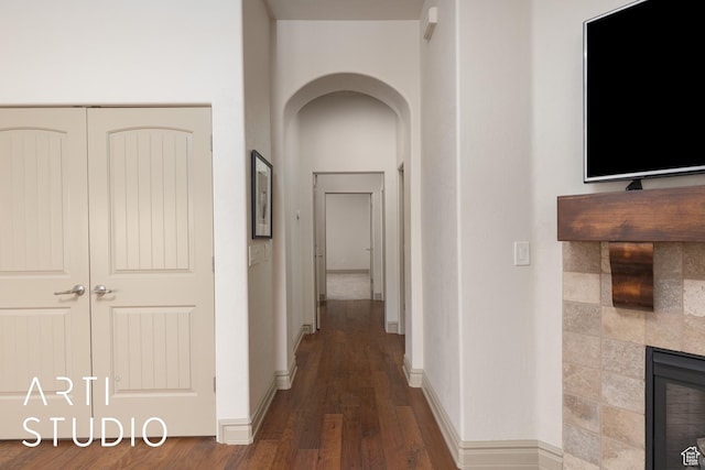 280 S Luce Del Sol Dr Unit 316, St George, UT 84770 - hallway featuring wood finished floors, arched walkways, and baseboards