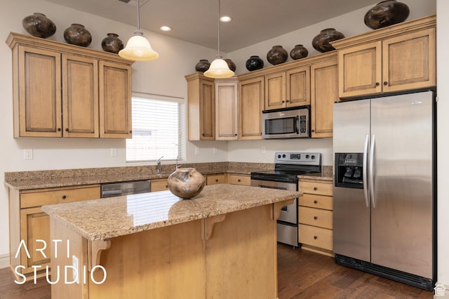 280 S Luce Del Sol Dr Unit 316, St George, UT 84770 - kitchen with stainless steel appliances, dark wood finished floors, a kitchen bar, a center island, and pendant lighting