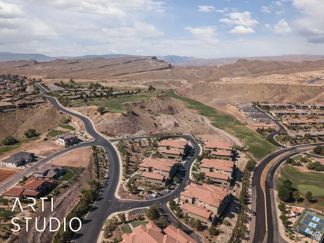 280 S Luce Del Sol Dr Unit 316, St George, UT 84770 - aerial view of property's location featuring a mountain backdrop and nearby suburban area