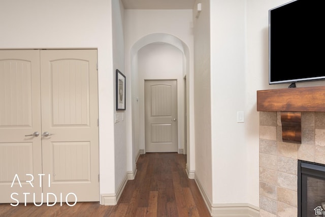 280 S Luce Del Sol Dr Unit 316, St George, UT 84770 - hallway featuring arched walkways, wood finished floors, and baseboards