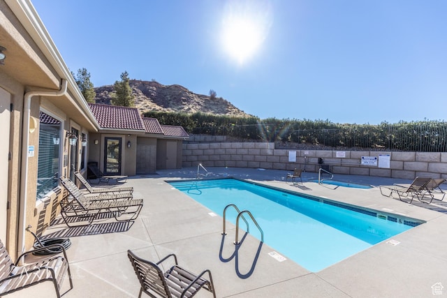 280 S Luce Del Sol Dr Unit 316, St George, UT 84770 - community pool with a mountain view, a fenced backyard, and a patio area