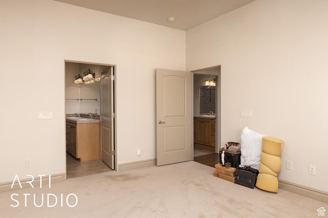 280 S Luce Del Sol Dr Unit 316, St George, UT 84770 - bedroom with light carpet, baseboards, and a walk in closet
