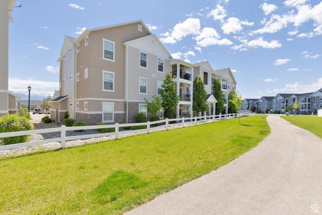13092 S Tortola Dr Unit 101, Herriman, UT 84096 - view of building exterior featuring a residential view
