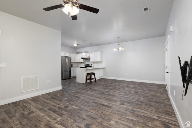 13092 S Tortola Dr Unit 101, Herriman, UT 84096 - living room with a ceiling fan, dark wood-style floors, and a chandelier