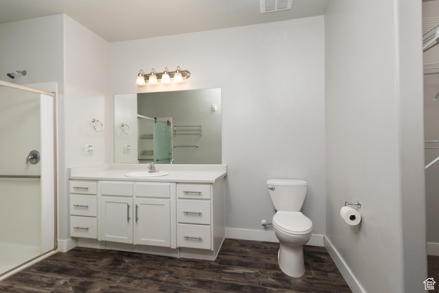 13092 S Tortola Dr Unit 101, Herriman, UT 84096 - full bathroom with a stall shower, vanity, wood finished floors, and a spacious closet