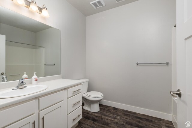 13092 S Tortola Dr Unit 101, Herriman, UT 84096 - full bath featuring vanity, wood finished floors, and a shower