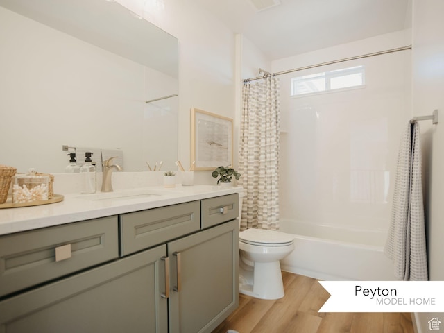 1549 W Boseman Way Unit 601, Saratoga Springs, UT 84045 - bathroom featuring wood finished floors, toilet, vanity, and shower / bathtub combination with curtain