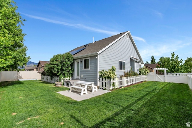 488 E Acord Way, Heber City, UT 84032 - back of property featuring roof mounted solar panels, a patio, and a shingled roof