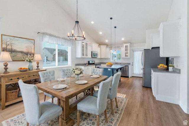 488 E Acord Way, Heber City, UT 84032 - dining area with a chandelier, plenty of natural light, high vaulted ceiling, light wood-style flooring, and recessed lighting
