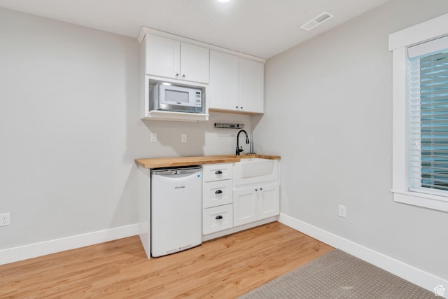 488 E Acord Way, Heber City, UT 84032 - kitchen featuring white appliances, a sink, butcher block counters, light wood-style floors, and white cabinetry