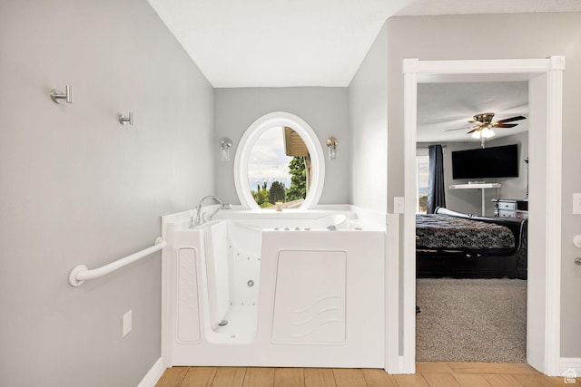 304 N 1000 E, Hyde Park, UT 84318 - bathroom featuring ceiling fan, a jetted tub, and baseboards