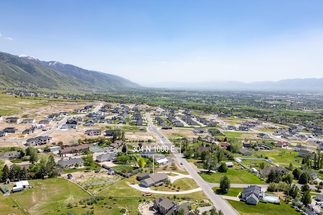 304 N 1000 E, Hyde Park, UT 84318 - aerial view of property and surrounding area featuring mountains and nearby suburban area