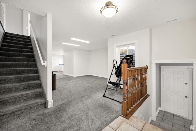 304 N 1000 E, Hyde Park, UT 84318 - stairs with baseboards, carpet floors, and a textured ceiling