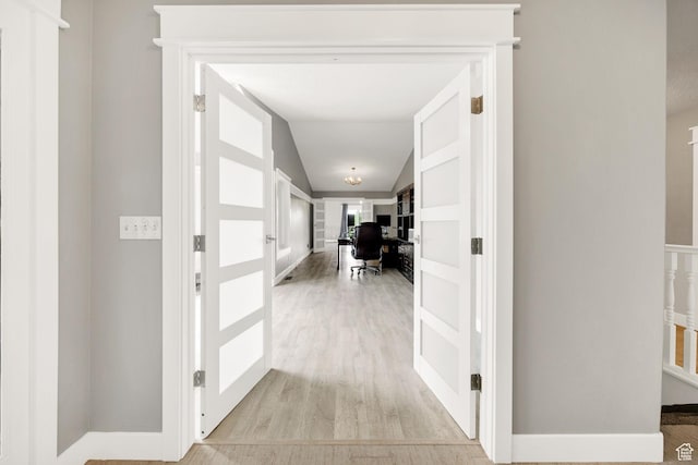 304 N 1000 E, Hyde Park, UT 84318 - hallway featuring light wood-type flooring, a desk, and lofted ceiling