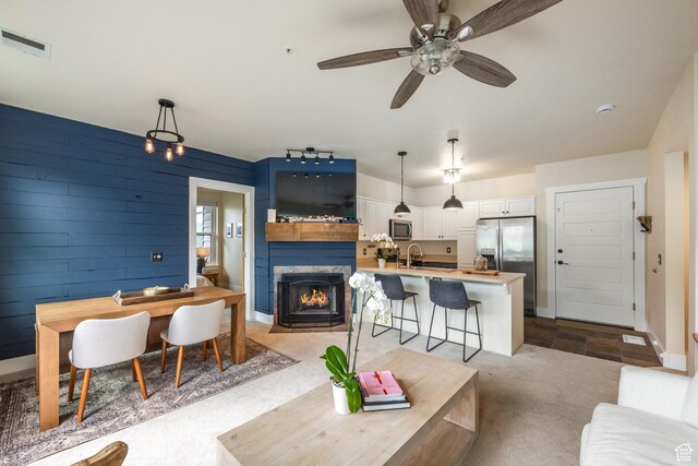 8430 Gambel Dr Unit Q23, Park City, UT 84098 - living area with a fireplace with flush hearth, light carpet, and ceiling fan