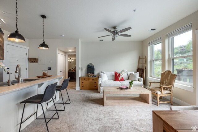 8430 Gambel Dr Unit Q23, Park City, UT 84098 - living room with light colored carpet, a ceiling fan, and baseboards