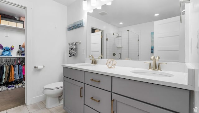 5241 W S Jordan Pkwy, South Jordan, UT 84009 - full bath with a stall shower, toilet, double vanity, recessed lighting, and baseboards