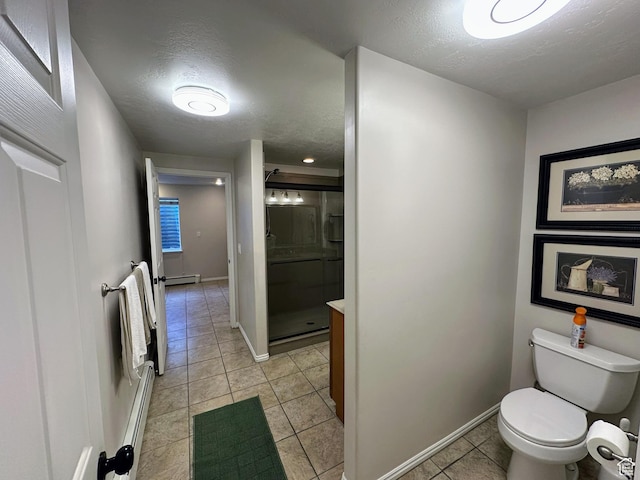 8675 S Pebblecreek Rd, West Jordan, UT 84081 - full bathroom featuring a shower stall, a textured ceiling, baseboard heating, toilet, and tile patterned floors